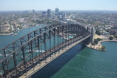 High angle view of bridge over river by buildings in city