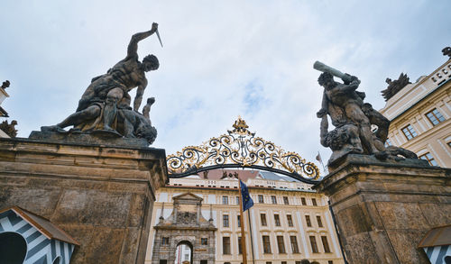 Low angle view of statue against cloudy sky