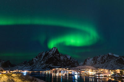 Scenic view of illuminated mountain against sky at night