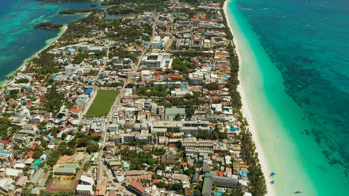 Tropical island boracay with sandy beach and hotels view from the sea, aerial view. philippines