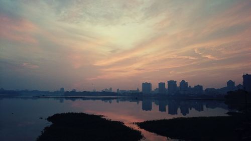 Scenic view of river at sunset