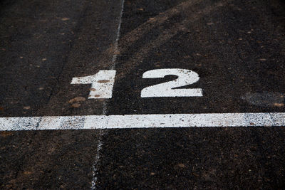 High angle view of arrow sign on road