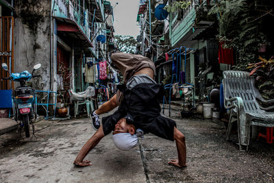 Rear view of men walking on road