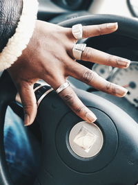 Close-up of man hand in car
