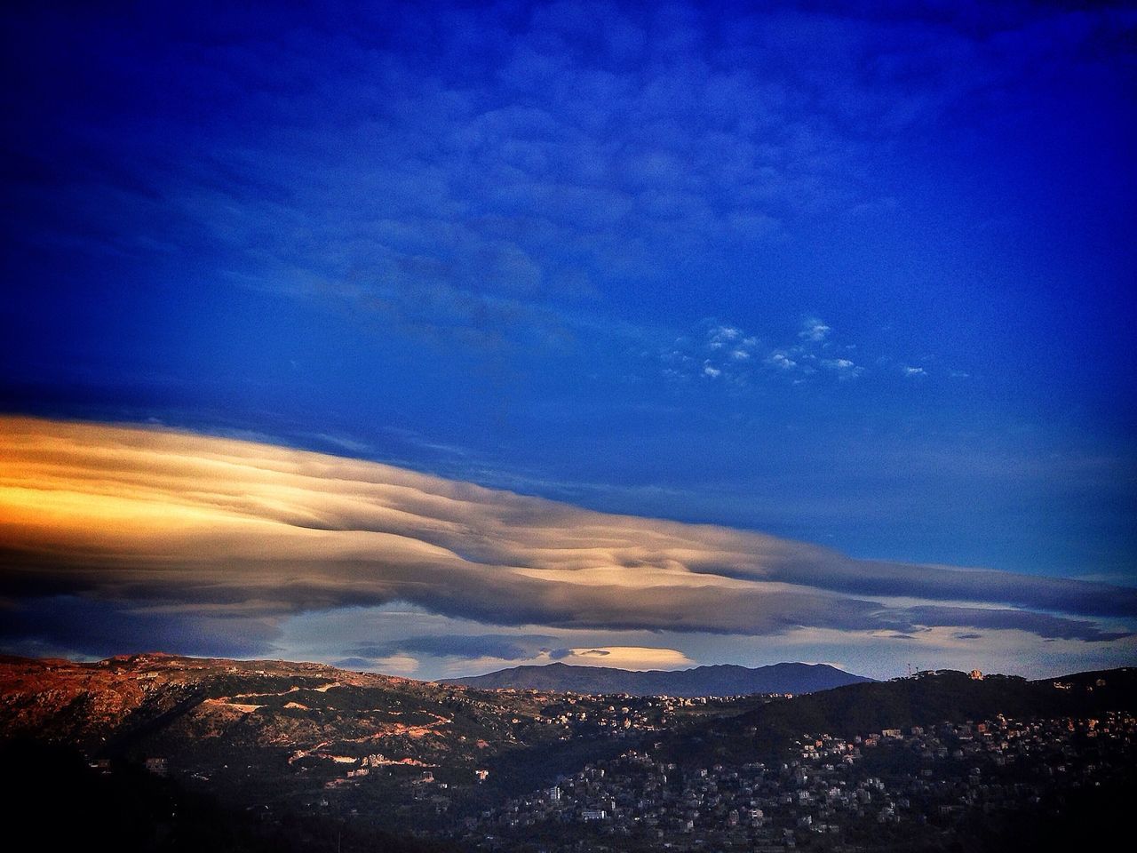 blue, sky, scenics, beauty in nature, aerial view, illuminated, cityscape, cloud - sky, tranquil scene, city, nature, building exterior, tranquility, dusk, built structure, architecture, sunset, idyllic, outdoors, night