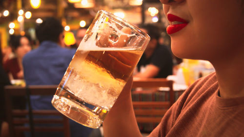 Close-up of a woman drinking glass