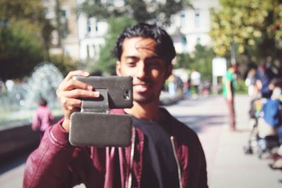 Woman photographing through smart phone