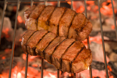 Close-up of steak roasting on barbecue grill