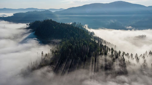 Foggy landscape on the hills in a cold morning seen from the mountains