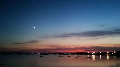 Scenic view of sea against sky at dusk