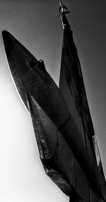 Low angle view of airplane against clear sky