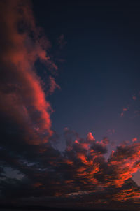 Low angle view of dramatic sky during sunset