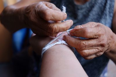 Close-up of man holding hands