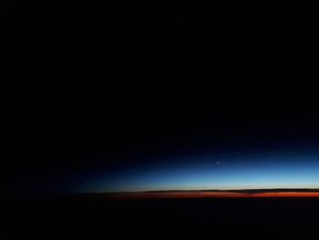 Scenic view of landscape against clear sky at night