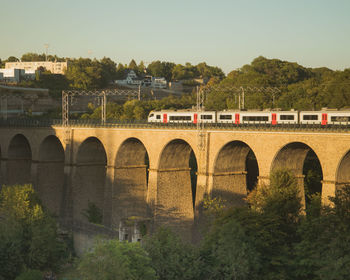  view of train on bridge in luxembourg 