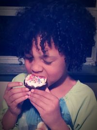 Close-up of young woman eating food