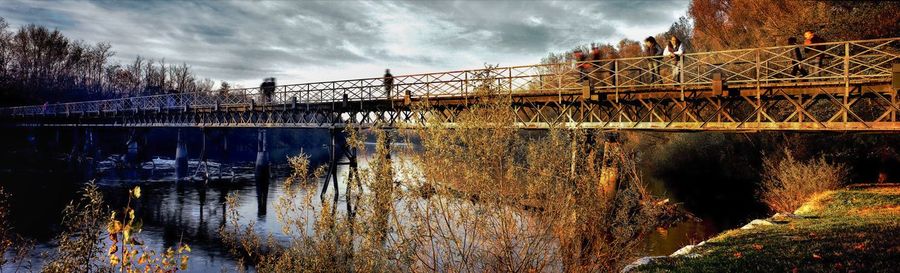 Bridge over river against sky