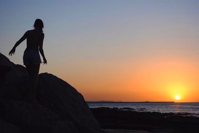 Scenic view of sea at sunset