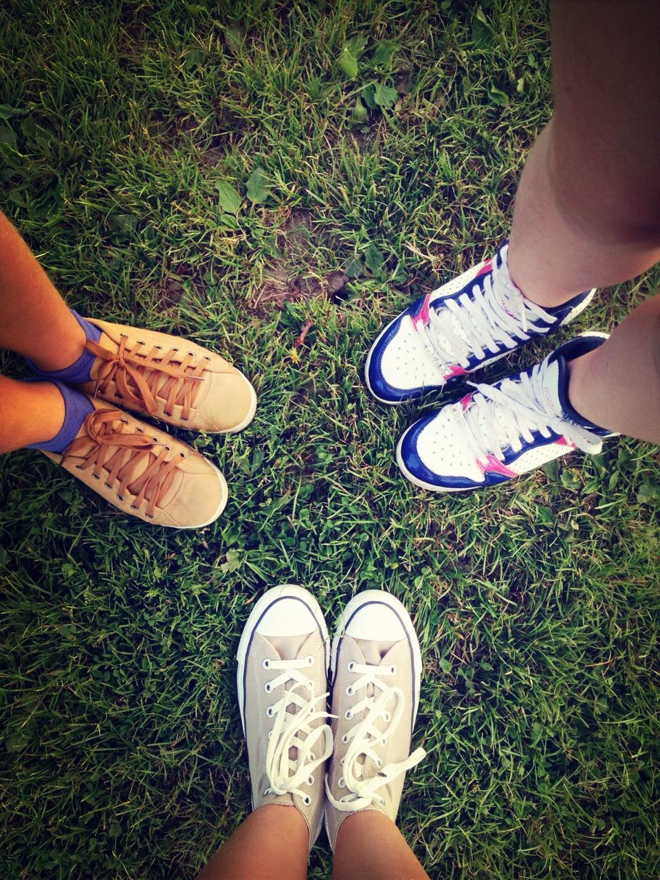 low section, person, shoe, personal perspective, grass, lifestyles, human foot, footwear, standing, leisure activity, high angle view, field, grassy, canvas shoe, sitting, part of