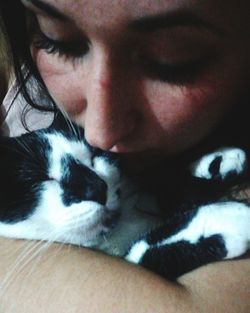 Close-up portrait of woman with cat