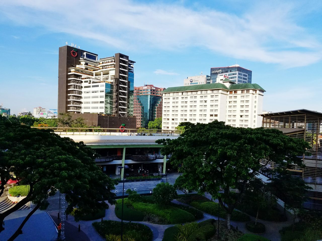 architecture, built structure, building exterior, tree, sky, city, cloud - sky, residential building, building, residential structure, water, day, palm tree, house, green color, growth, outdoors, no people, cloud, plant