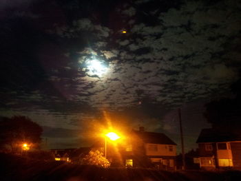 View of illuminated street lights at night