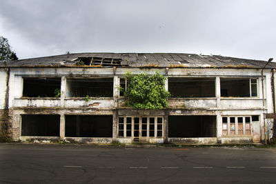 Exterior of abandoned building against sky