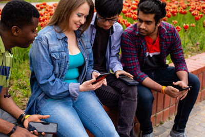 People sitting on mobile phone