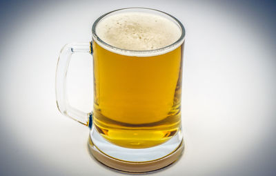 Close-up of beer glass on table