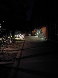 Empty illuminated road at night