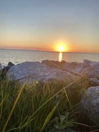 Scenic view of sea against sky during sunset