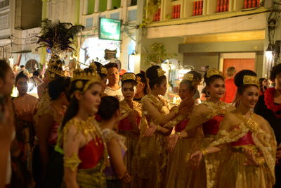 Group of people in city at night