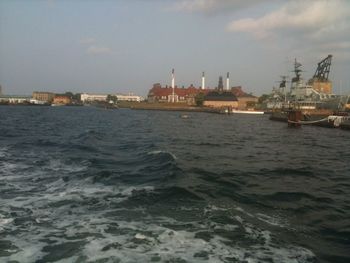 Scenic view of sea against cloudy sky