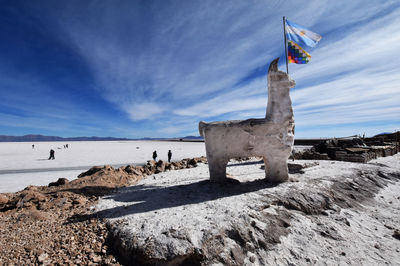 Scenic view of salt lake against sky