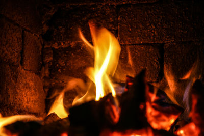A beautiful close up of a fire burning in wooden stove
