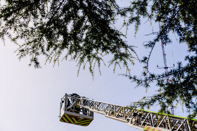 Low angle view of ferris wheel against sky