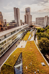 High angle view of street amidst buildings against sky