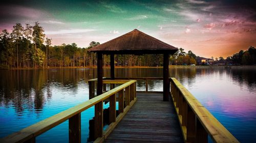 Pier over lake against sky