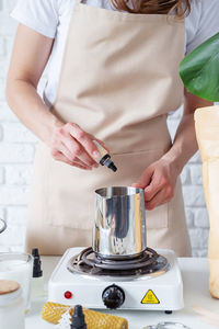 Midsection of man preparing food