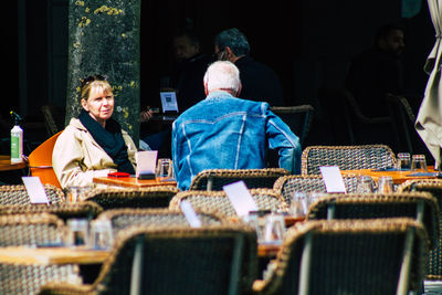 People sitting on chair at table