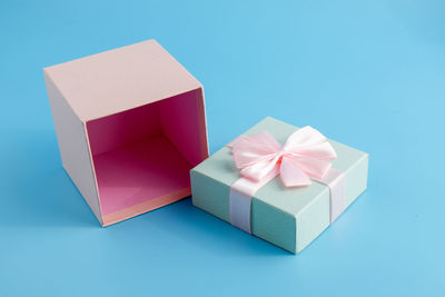 Close-up of gift box on blue background