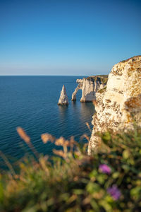 Scenic view of sea against clear blue sky