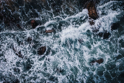 High angle view of water splashing in sea