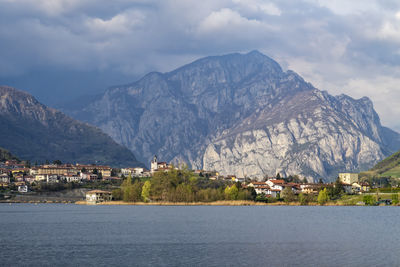 Scenic view of sea and mountains against sky