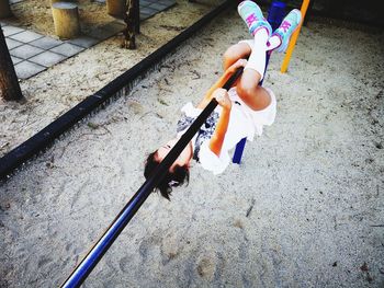 High angle view of girl playing with toy