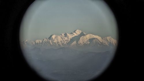 Scenic view of snow covered mountains