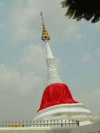 Low angle view of sculpture against building