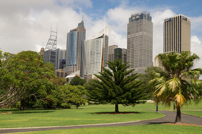 Modern buildings against cloudy sky