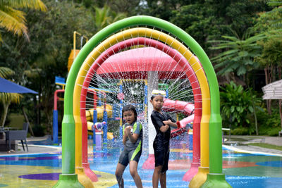 Full length of children in swimming pool