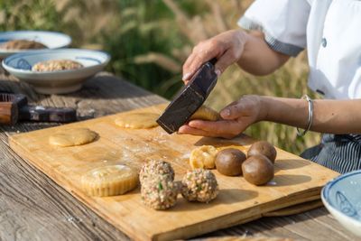 Man preparing food on cutting board